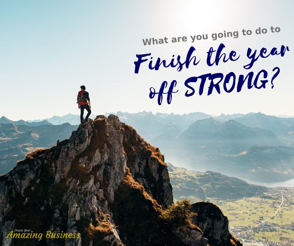 Person standing on a mountain with the words "What are you going to do to finish the year off strong?"