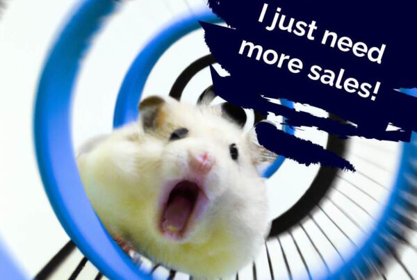 a hamster running frantically in a hamster wheel yelling "I just need more sales"